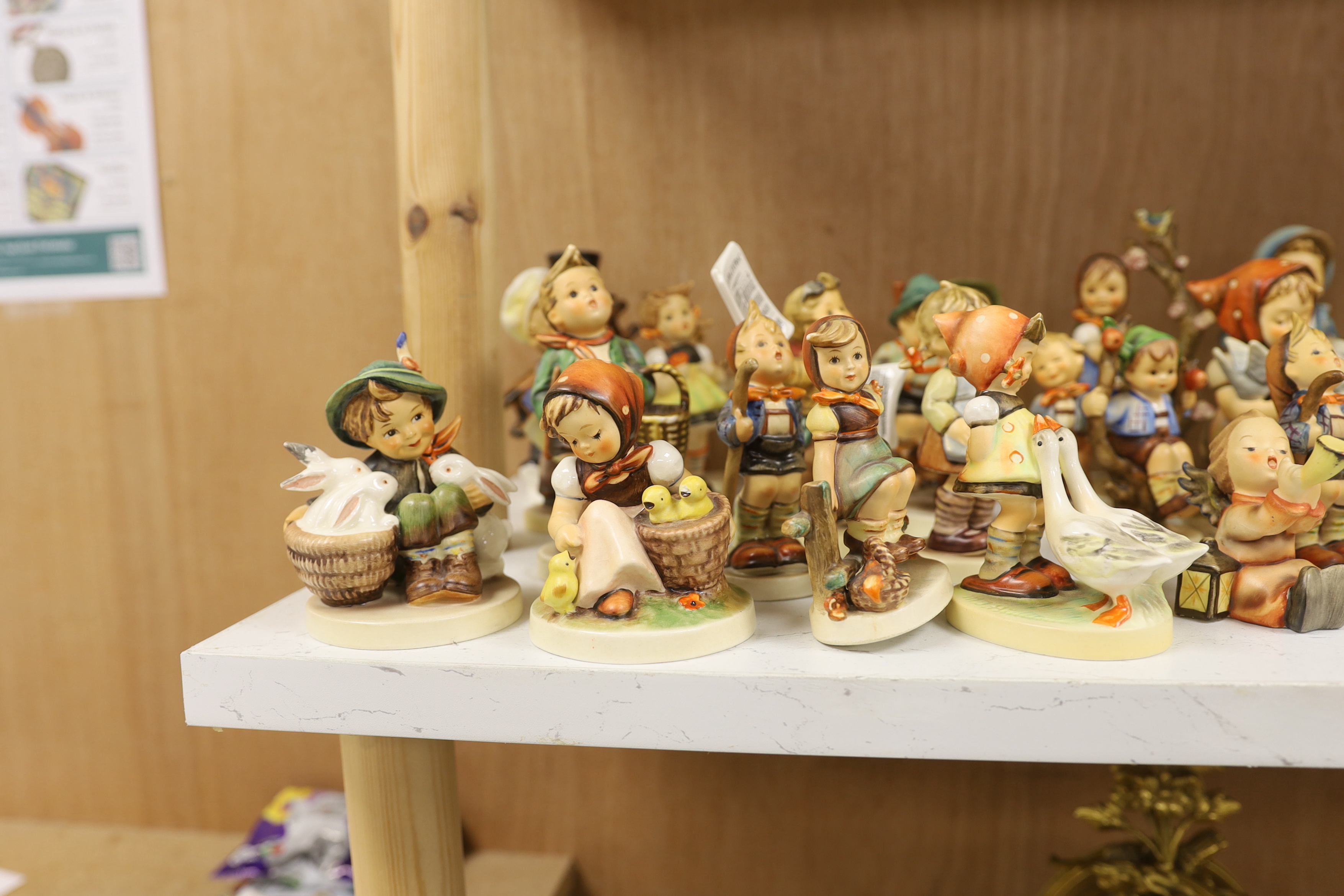 Twenty eight Goebel Hummel figures, largest 15cm high